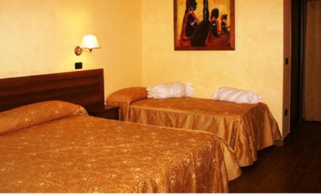 Postel nebo postele na pokoji v ubytování Hotel Cuor Di Puglia