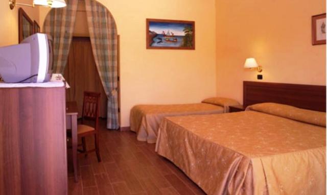 Postel nebo postele na pokoji v ubytování Hotel Cuor Di Puglia