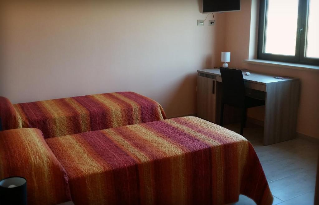 Łóżko lub łóżka w pokoju w obiekcie Villa La Mulinella