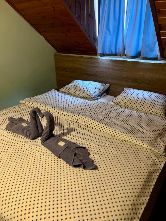 Postel nebo postele na pokoji v ubytování M1 Laczházy Hotel Coffee & More
