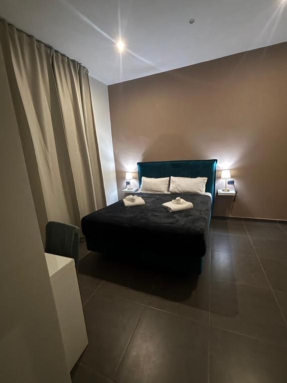 Posteľ alebo postele v izbe v ubytovaní Doria Suites Napoli