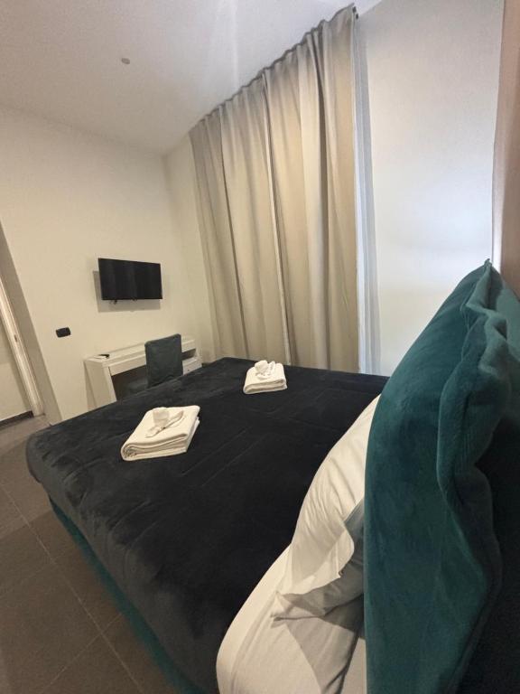 Posteľ alebo postele v izbe v ubytovaní Doria Suites Napoli
