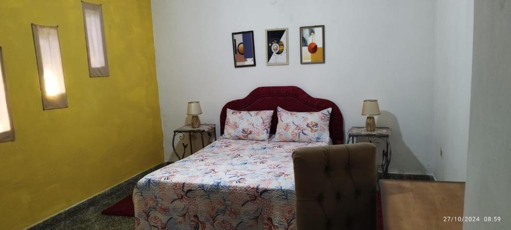 A bed or beds in a room at Hostal Maison Belle