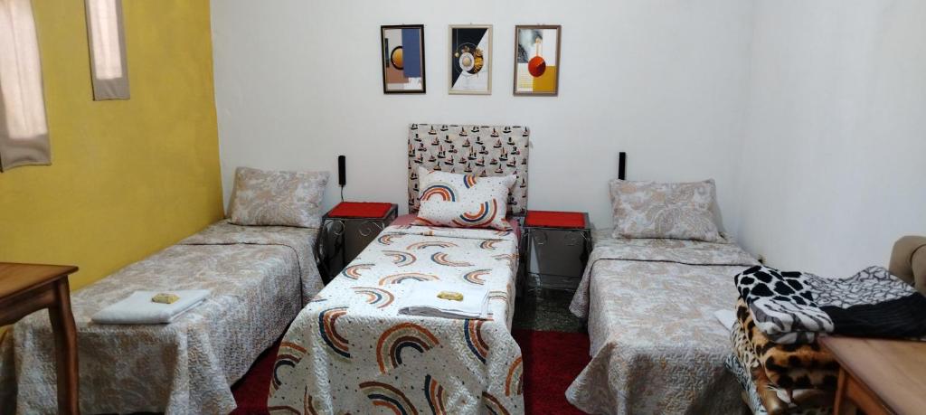 A bed or beds in a room at Hostal Maison Belle