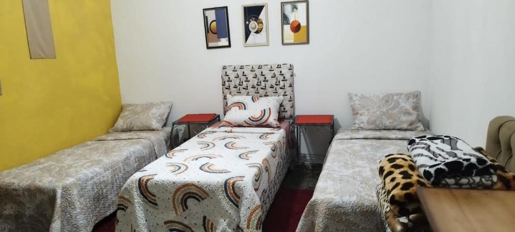 A bed or beds in a room at Hostal Maison Belle
