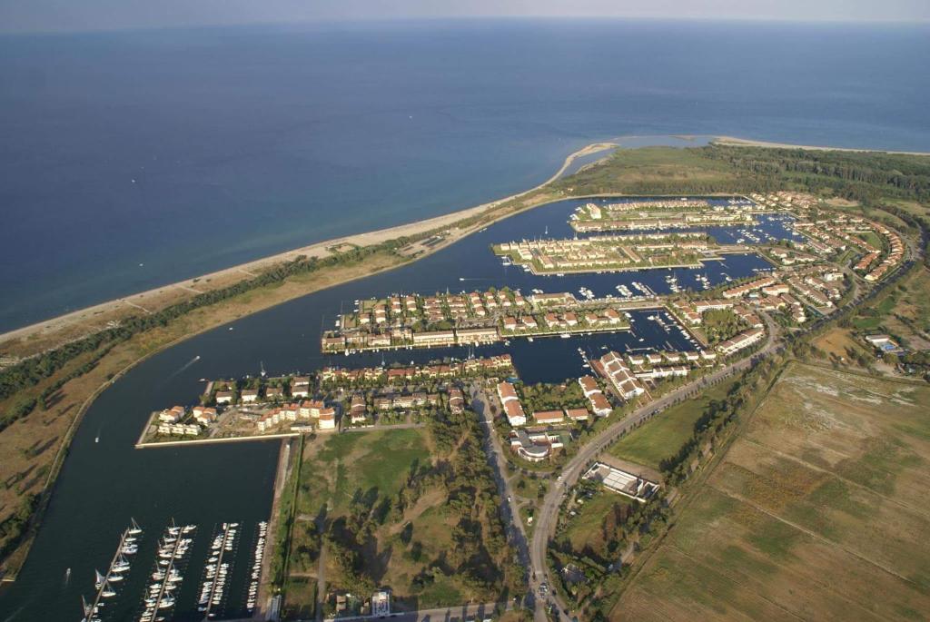an aerial view of a harbor with houses and boats at Residence La Bricola 239 in I Casoni