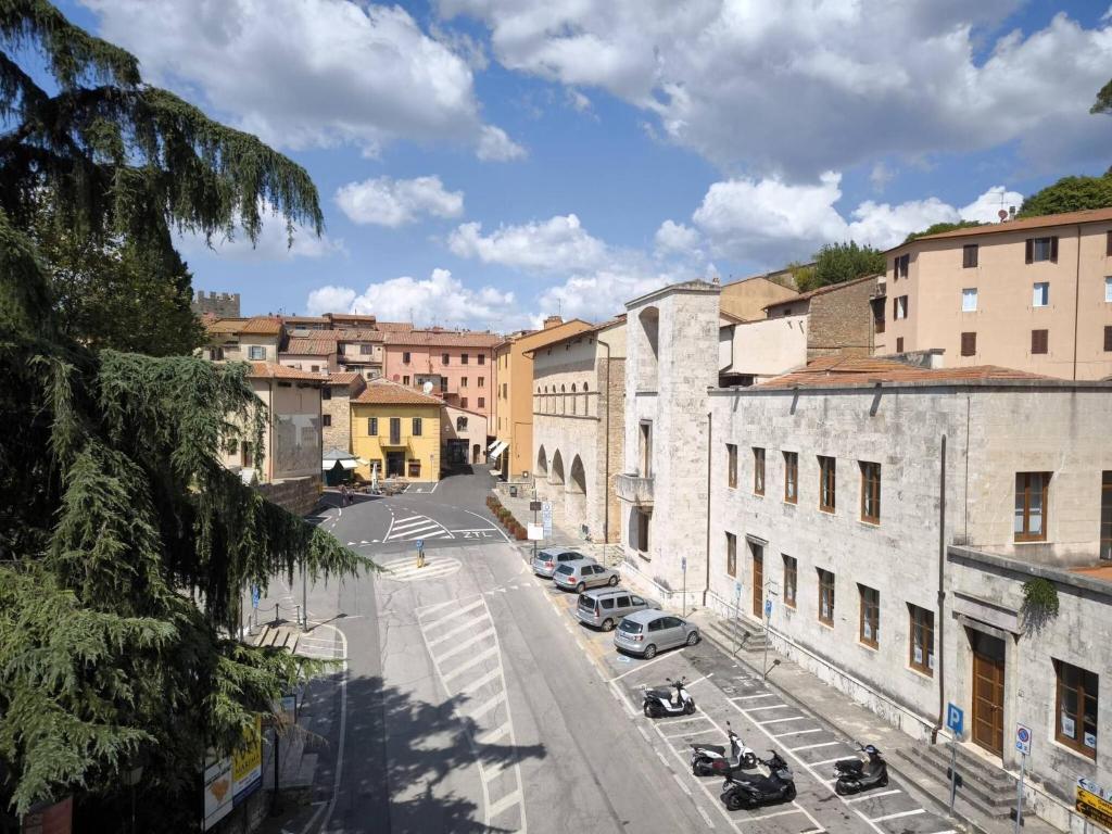 a view of a city street with cars parked at Kira Apartment Bike Friendly in Massa Marittima