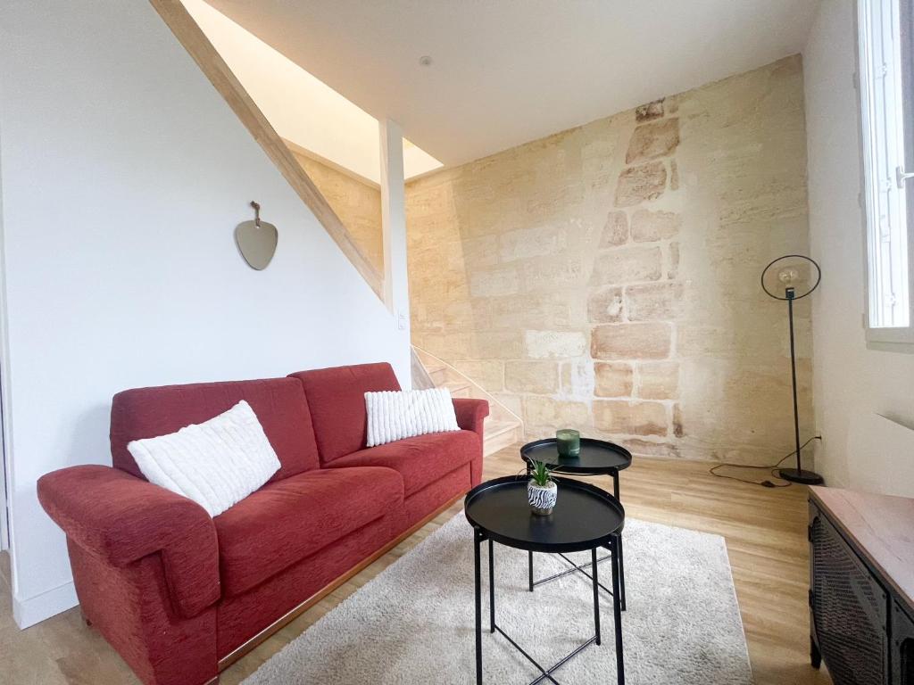 Ruang duduk di Maison spacieuse proche Bordeaux