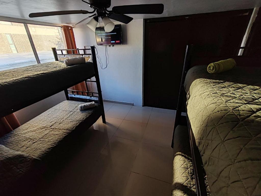 Postel nebo postele na pokoji v ubytování Hostal vitta
