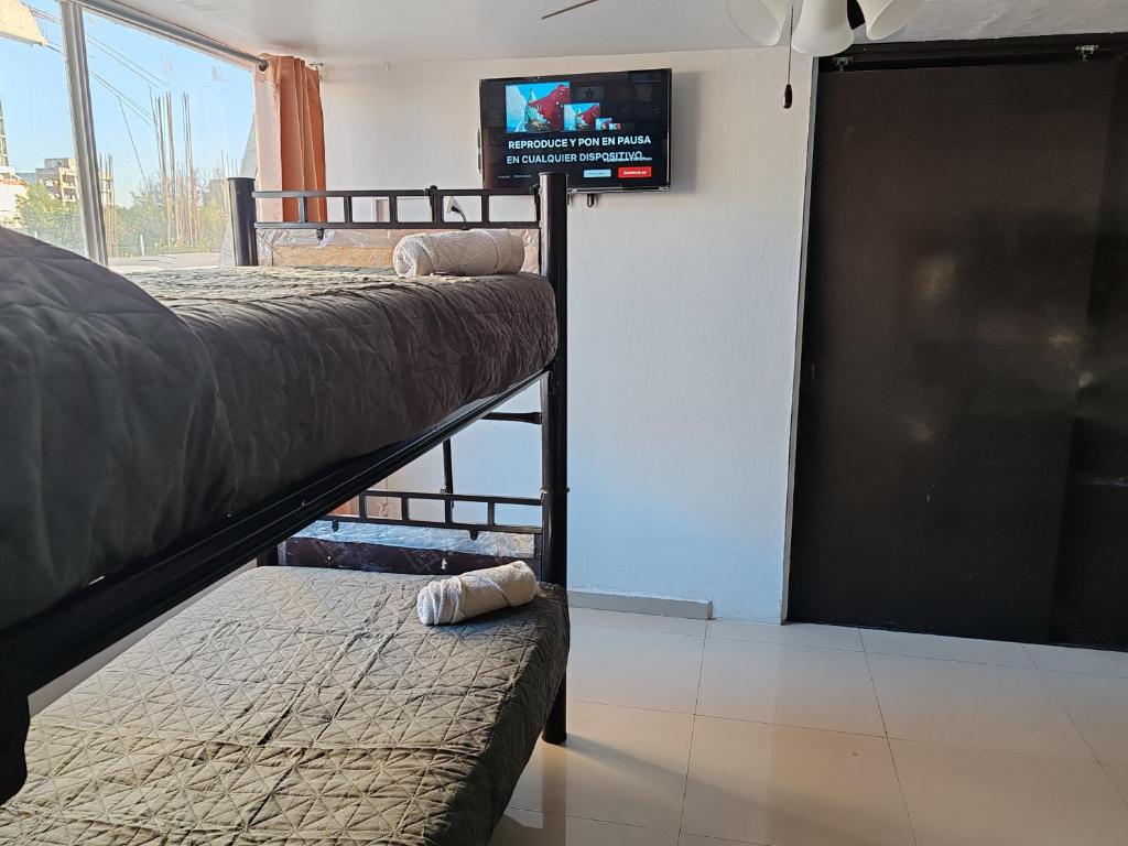 Postel nebo postele na pokoji v ubytování Hostal vitta