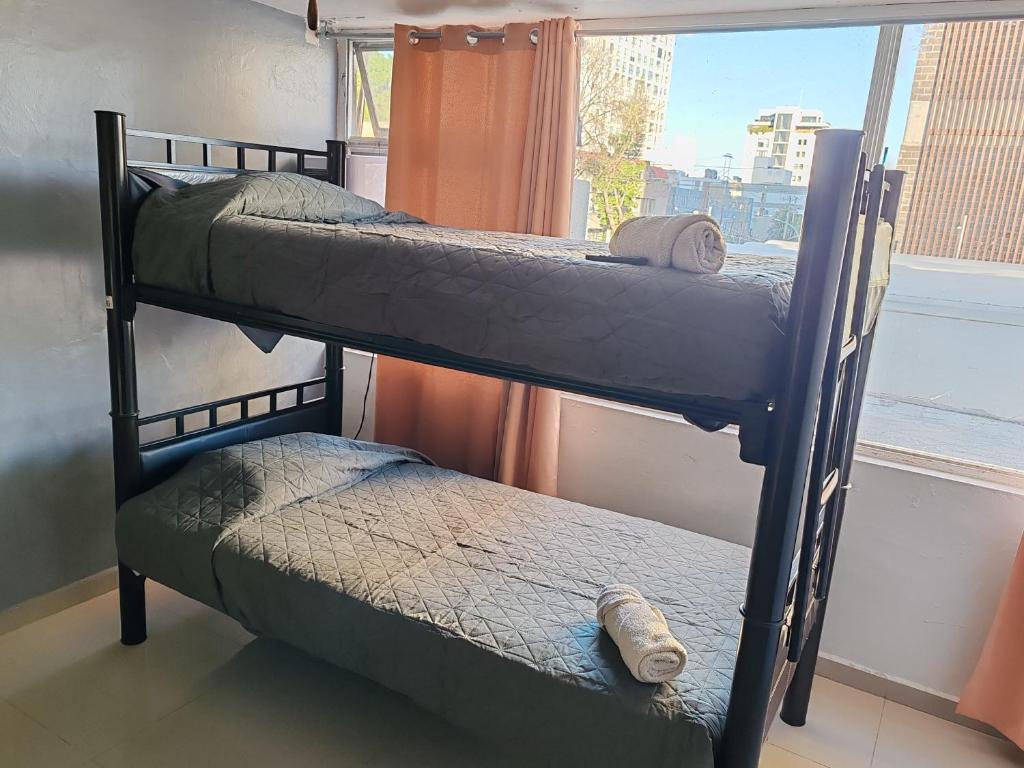 Postel nebo postele na pokoji v ubytování Hostal vitta