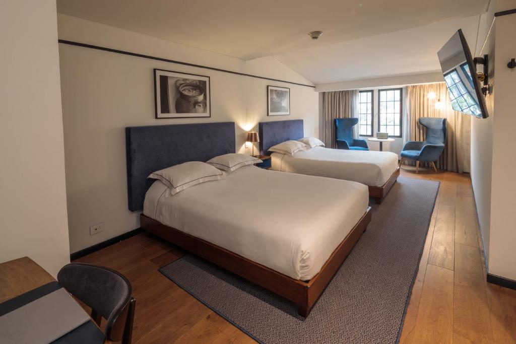 Postel nebo postele na pokoji v ubytování HAB Hotel Bogotá