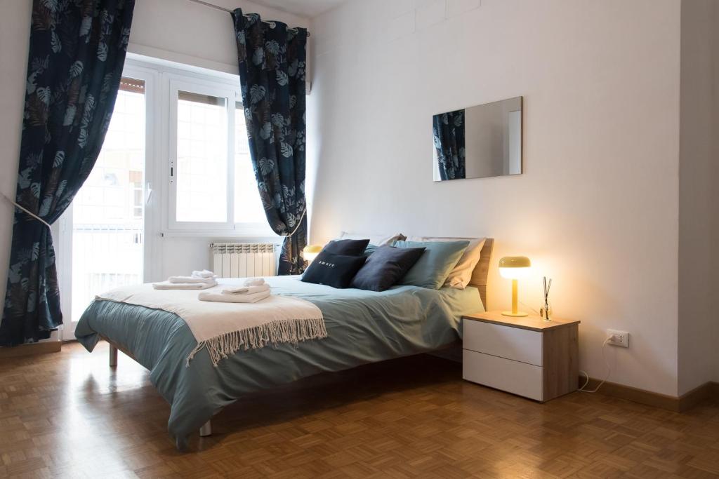 Letto o letti in una camera di Casa Eva - Roma