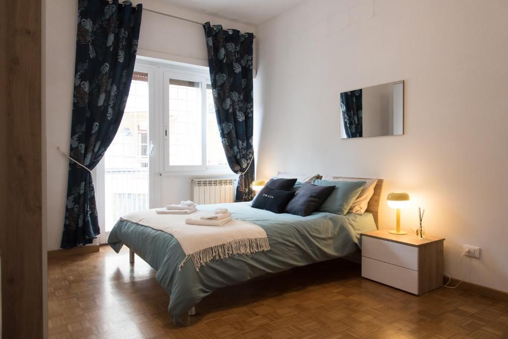 Letto o letti in una camera di Casa Eva - Roma