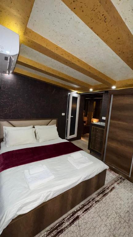 Postel nebo postele na pokoji v ubytování Hotel Premium