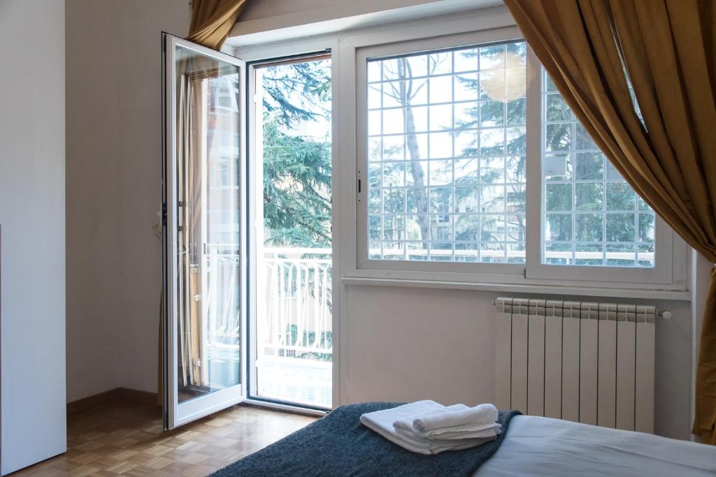 Letto o letti in una camera di Casa Eva - Roma