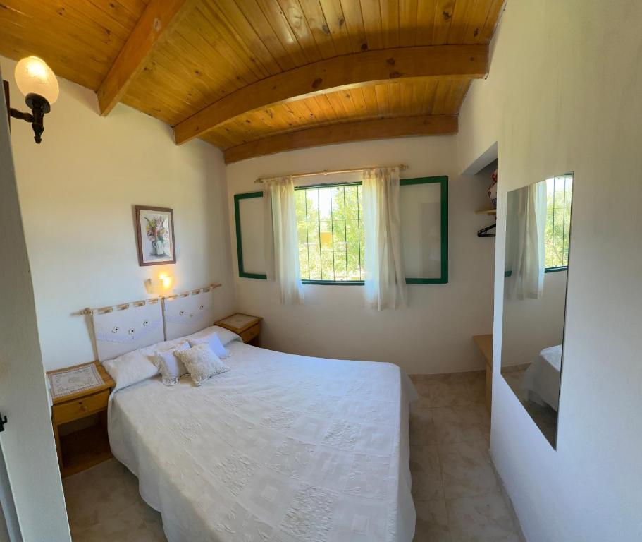 Ένα ή περισσότερα κρεβάτια σε δωμάτιο στο Los Prados