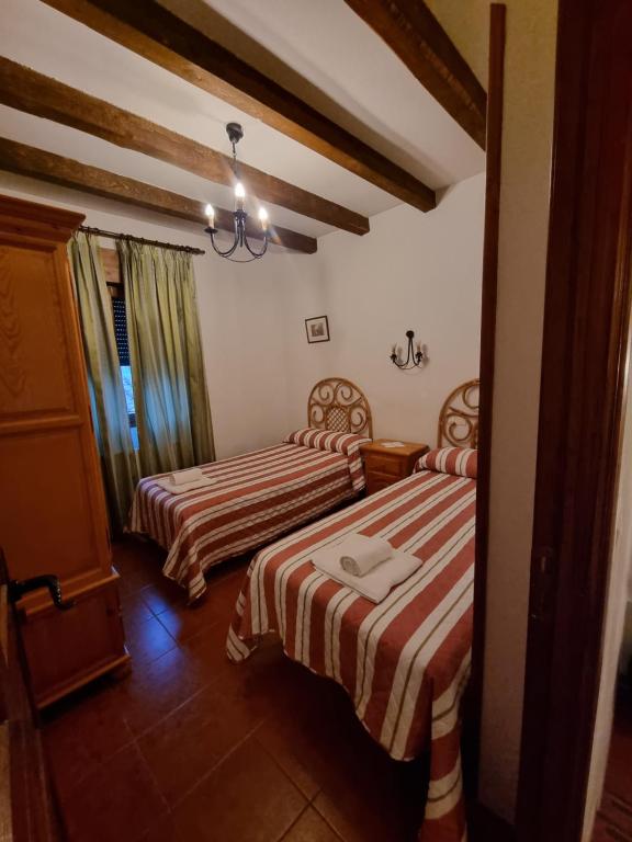 Postel nebo postele na pokoji v ubytování La Casa de Tio Claudio