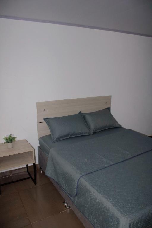 Postel nebo postele na pokoji v ubytování BogoRooms Av Suba 116