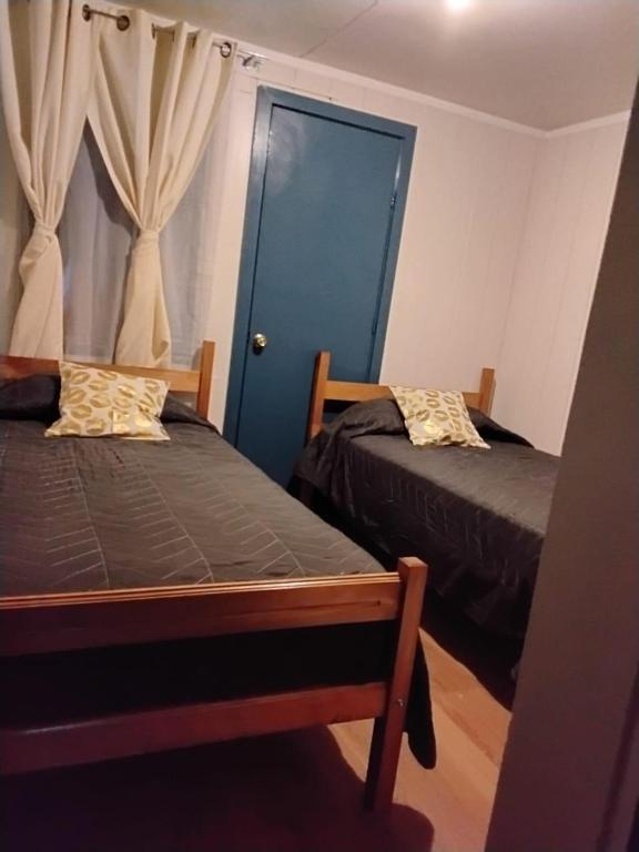 Postel nebo postele na pokoji v ubytování Hostal Maravillas del Sur