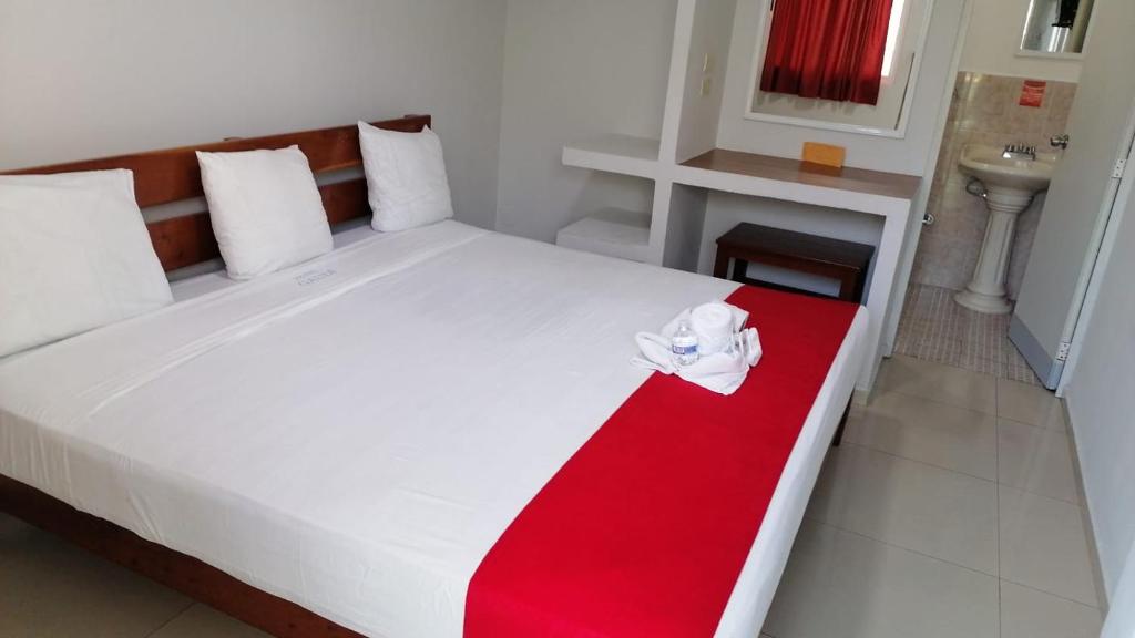 Postel nebo postele na pokoji v ubytování Hotel MCH