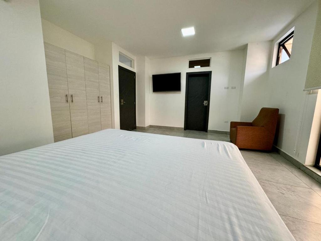 Postel nebo postele na pokoji v ubytování Hotel Ramedi