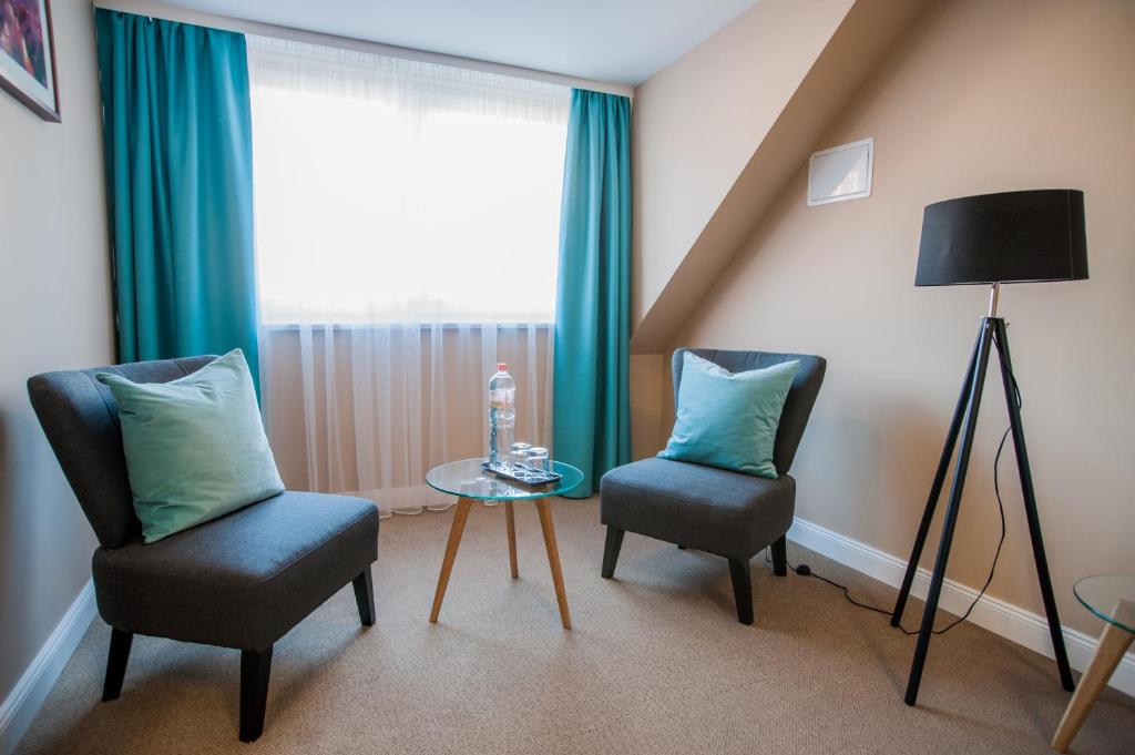 Posezení v ubytování Braun Rooms Deluxe