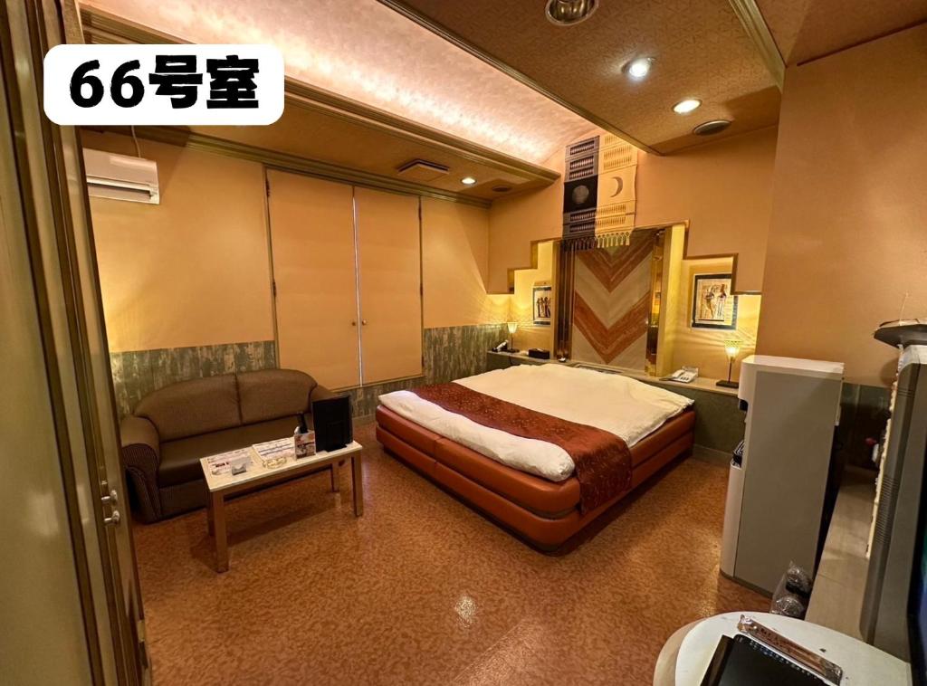 Postel nebo postele na pokoji v ubytování 大人専用ホテルイエスタディ