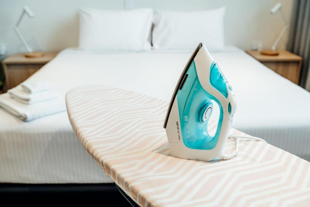 a computer monitor sitting on top of a bed at Mary MacKillop Place in Sydney