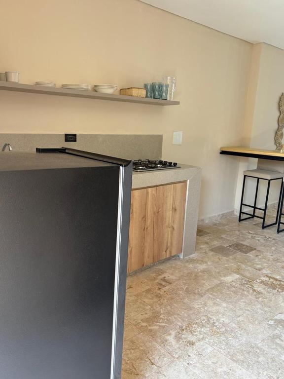Kuchyň nebo kuchyňský kout v ubytování Forest Condominio