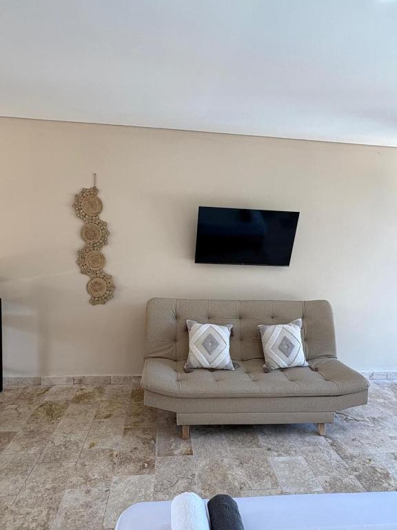 TV a/nebo společenská místnost v ubytování Forest Condominio