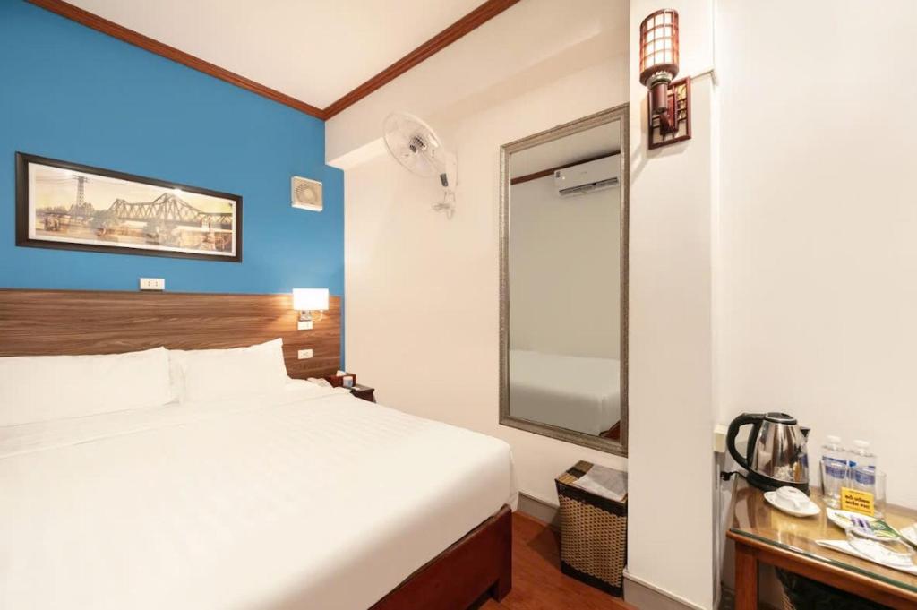 Postel nebo postele na pokoji v ubytování A25 Hotel - 26 Hàng Nón