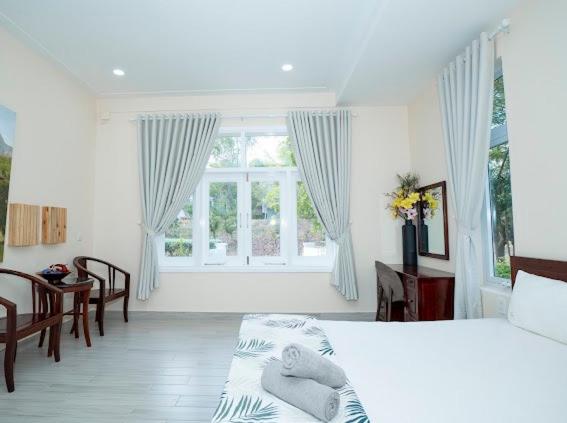 Postel nebo postele na pokoji v ubytování Villa Sea Links ( Biệt Thự nghỉ dưỡng )