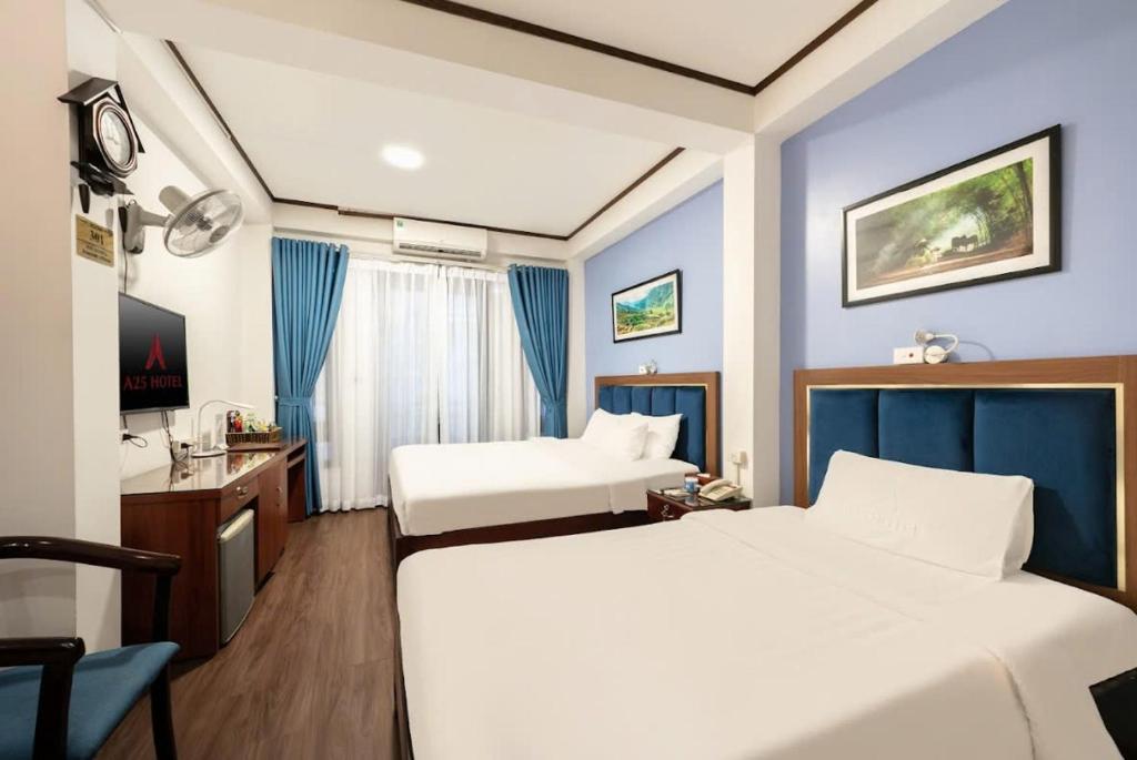 Postel nebo postele na pokoji v ubytování A25 Hotel - 26 Hàng Nón