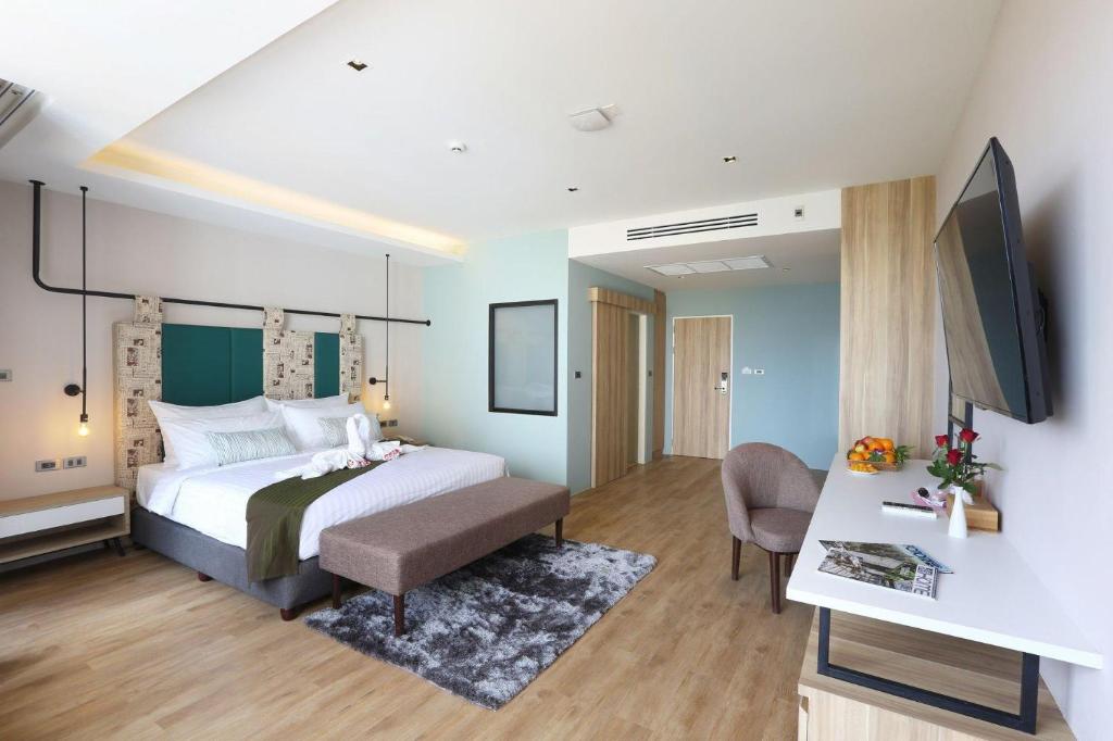 Postel nebo postele na pokoji v ubytování W3 Hotel