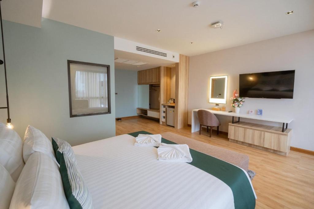 Postel nebo postele na pokoji v ubytování W3 Hotel