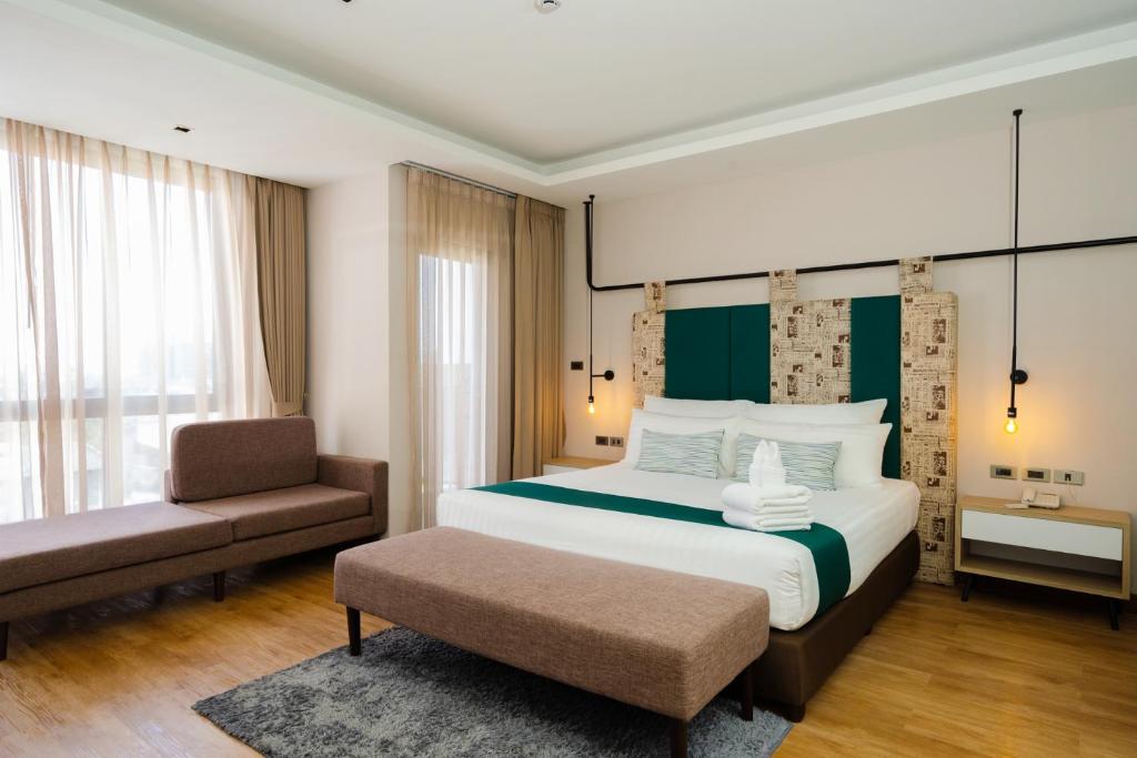 Postel nebo postele na pokoji v ubytování W3 Hotel