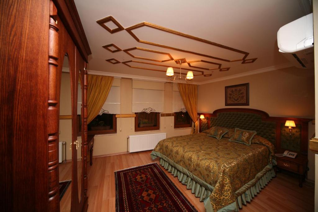Postel nebo postele na pokoji v ubytování Aruna Boutique Hotel