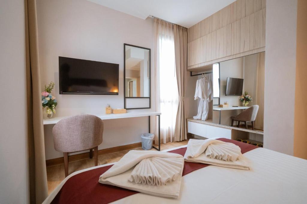 Postel nebo postele na pokoji v ubytování W3 Hotel