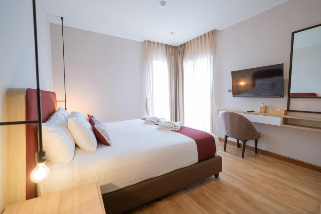 Postel nebo postele na pokoji v ubytování W3 Hotel
