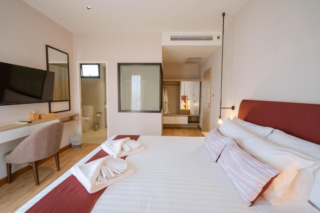 Postel nebo postele na pokoji v ubytování W3 Hotel