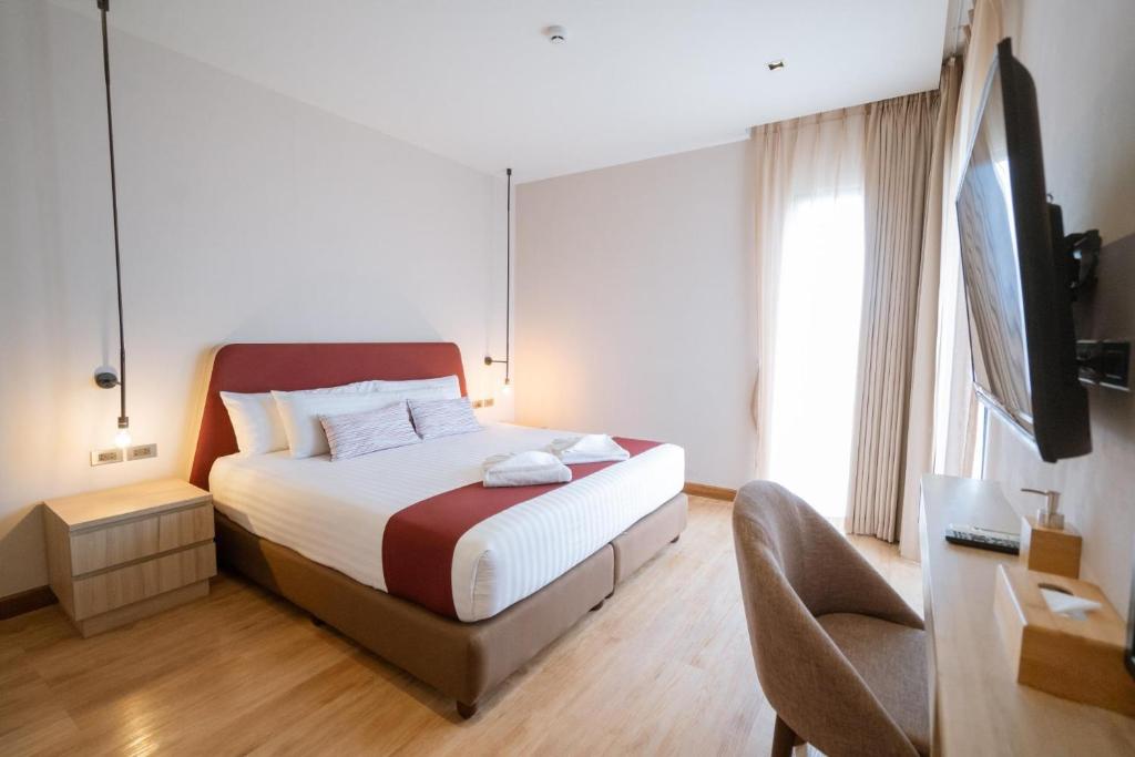 Postel nebo postele na pokoji v ubytování W3 Hotel