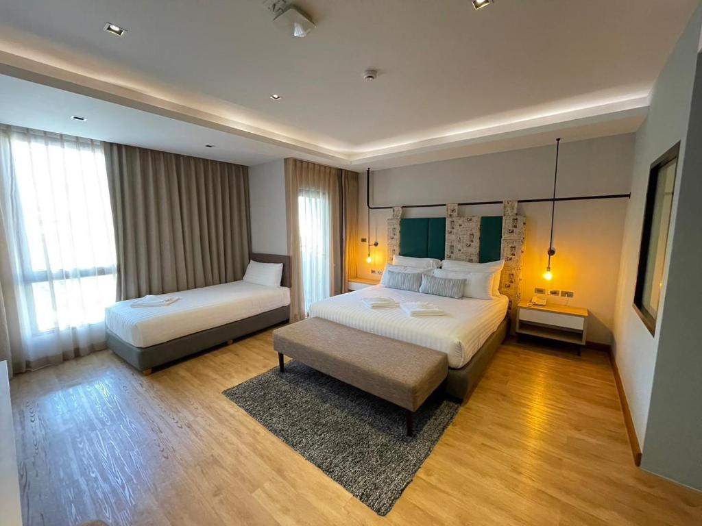 Postel nebo postele na pokoji v ubytování W3 Hotel
