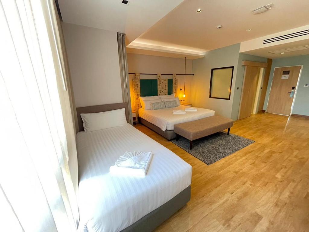 Postel nebo postele na pokoji v ubytování W3 Hotel