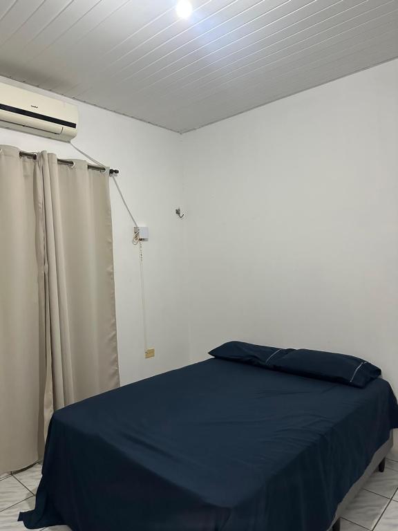 Postel nebo postele na pokoji v ubytování Primeiro andar charmoso