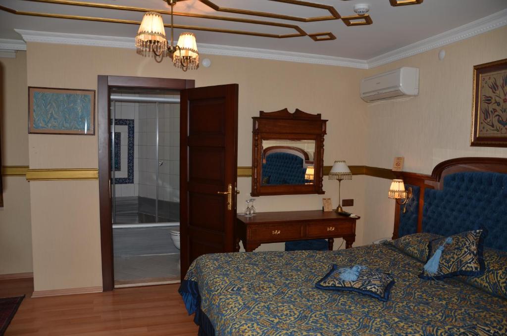 Postel nebo postele na pokoji v ubytování Aruna Boutique Hotel