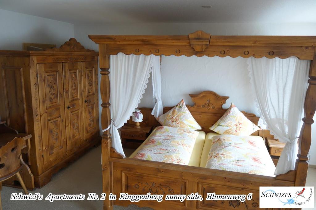 Postel nebo postele na pokoji v ubytování Schwizi's Apartments