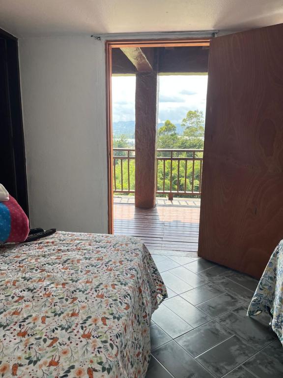 Postel nebo postele na pokoji v ubytování Hostal Inn II Rionegro