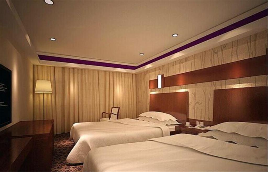 Postel nebo postele na pokoji v ubytování Nanning Qingzhou Rental Apartments