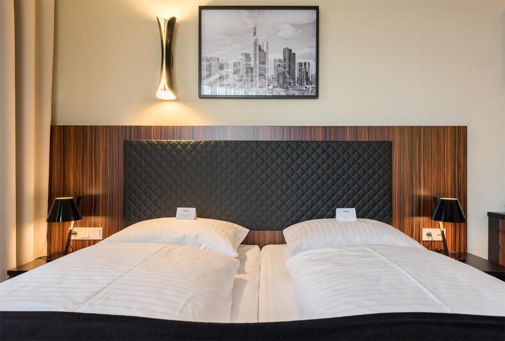 Cama ou camas em um quarto em The Frankfurt